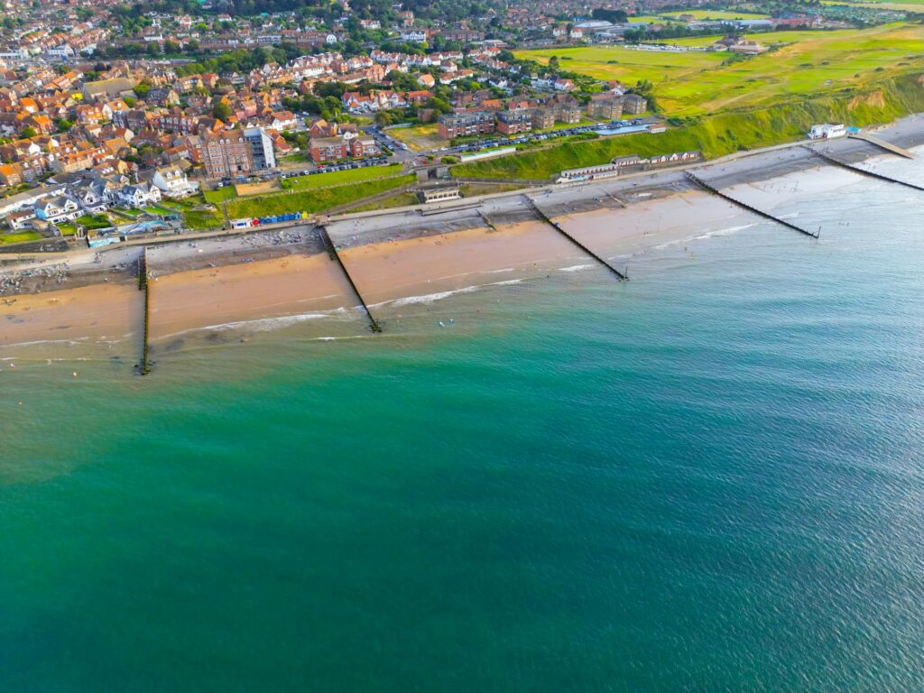 Vibrant aerial shot of Sheringham beach and town on a sunny day in Norfolk, England