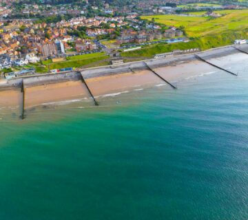 Vibrant aerial shot of Sheringham beach and town on a sunny day in Norfolk, England